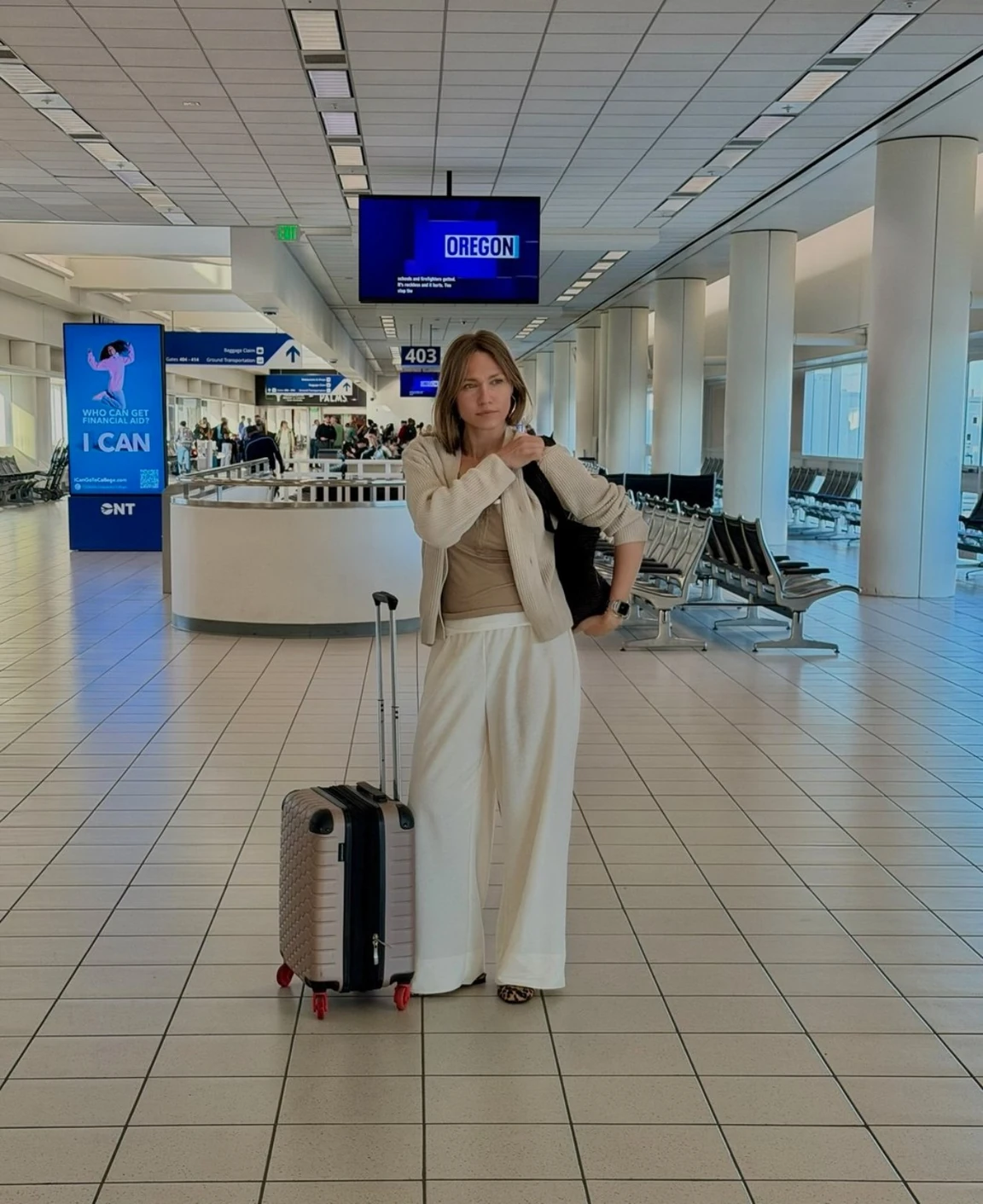Jenny wearing a comfortable polished travel outfit at the airport